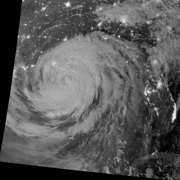 Hurricane swirl as Isaac makes landfall in Lousiana contrasts with the bright city lights in the southeastern US