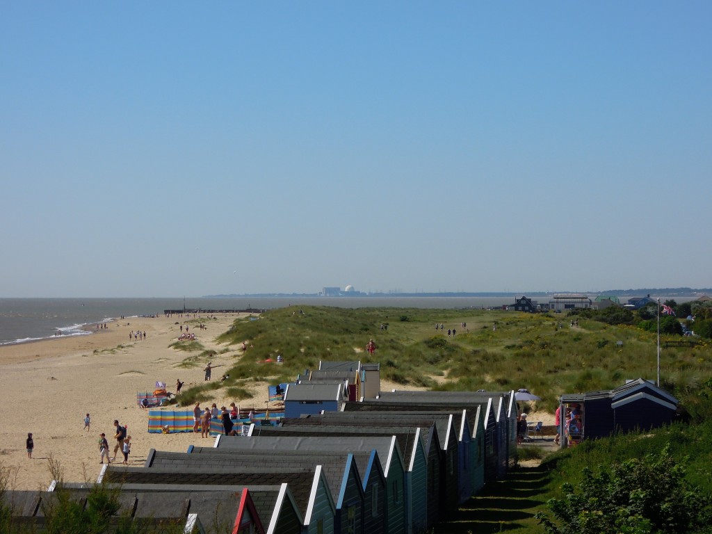 Looking south from Southwold. Sizewell nuclear power station on horizon. Bay in the middle used to contain Dunwich