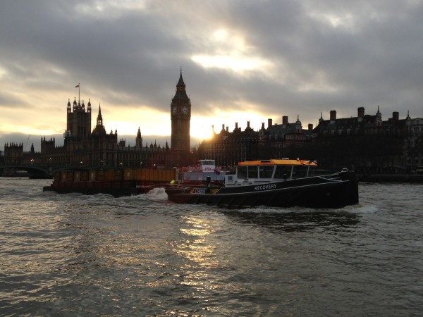 Boats on the river at sunset with Parliament in the background