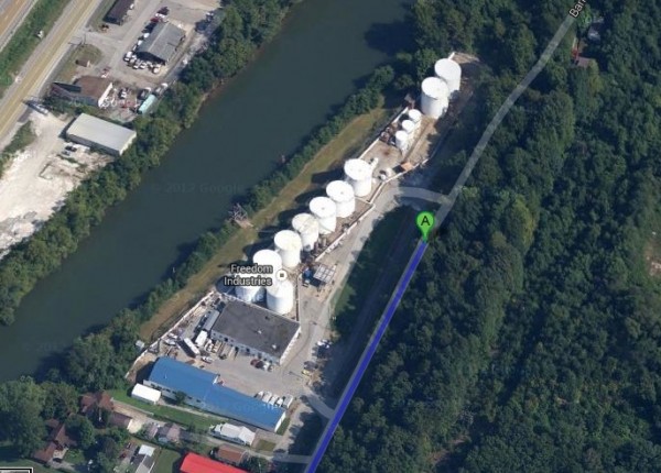 Google Maps view of white industrial tanks adjacent to a river.