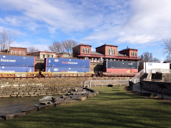 Rivers have long been transportation corridors. Historic Kent depot behind the modern freight train running next to the river, with its remnant lock system. (Photo by A. Jefferson, March 2015). 